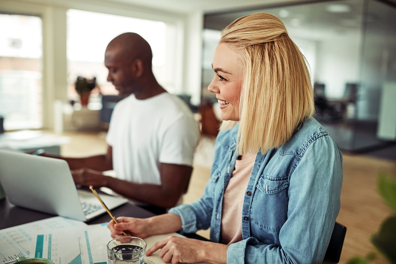 young-businesswoman-smiling-during-a-meeting-in-RM5QXDU.jpg